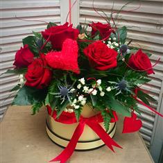 Large hatbox with half dozen roses